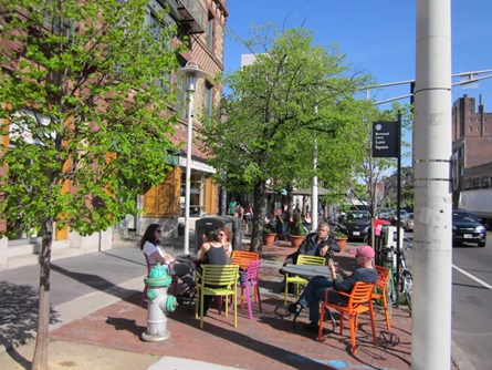 Public dining in Central Square with colorful chairs