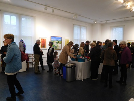 Attendees viewing art at the Cambridge Open Studios reception