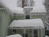snow of roof of house