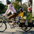 Mother and two children enjoying a bike ride