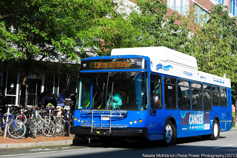EZRide shuttle bus at curb with lots of bicycles