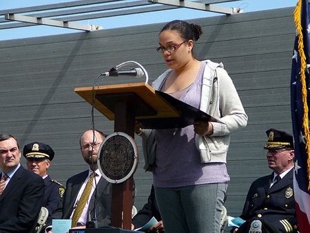 CRLS drama student Kristen Johnson reads the Governor's Proclamation.