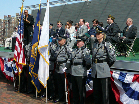Cambridge Mayor E. Denise Simmons (far left) with members of the City Council (on podium) and the Assembly of Colors   