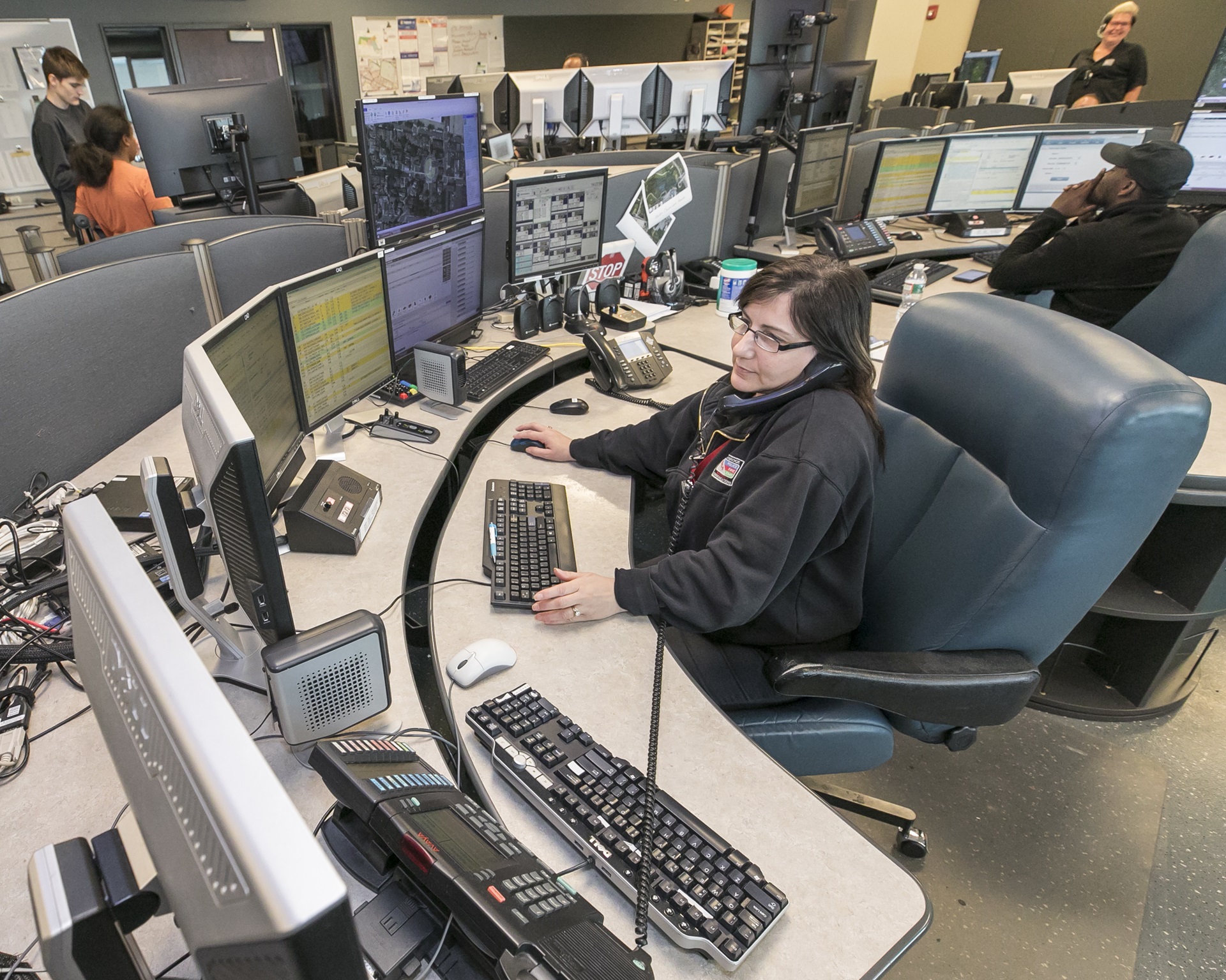 Cambridge Emergency Communications dispatchers work at their stations