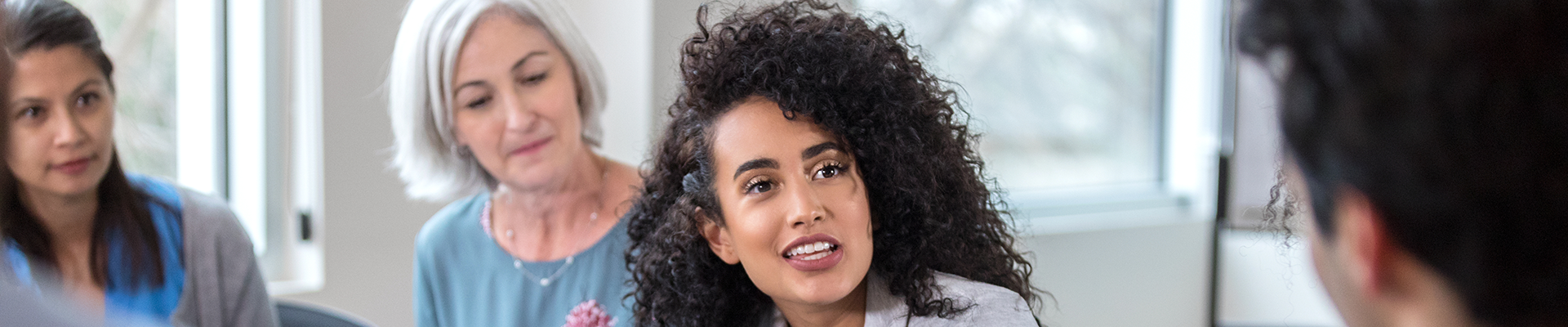 A group of four people having a discussion