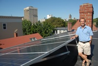 David Neiman with solar panels