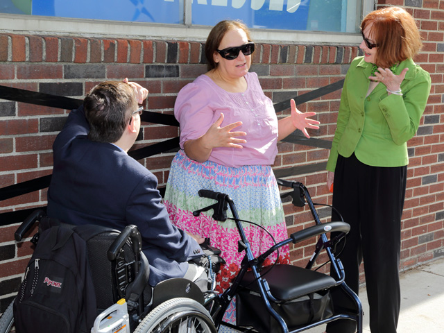 Sidewalk conversation with disabled person