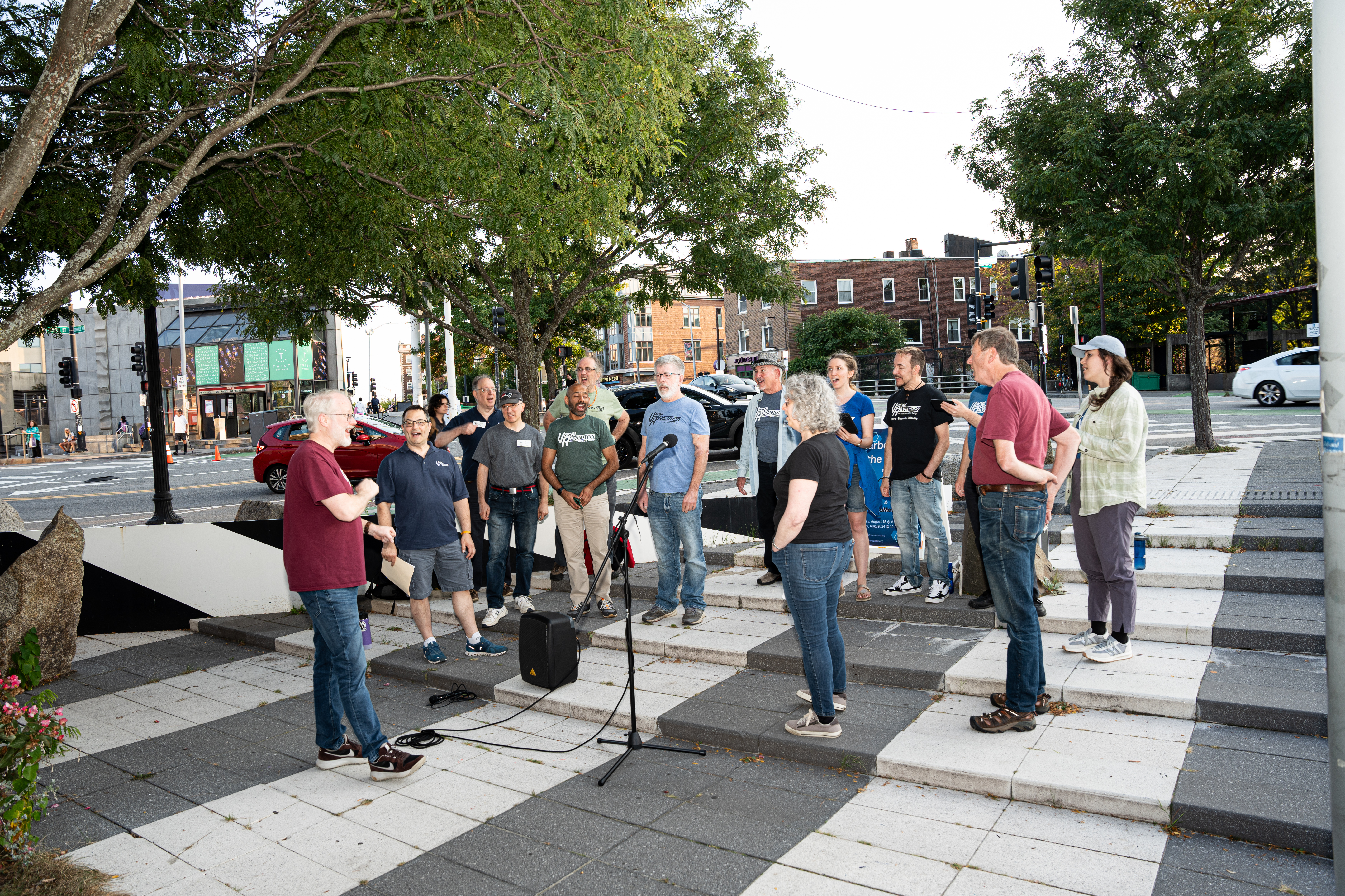 People signing outside in a circle.