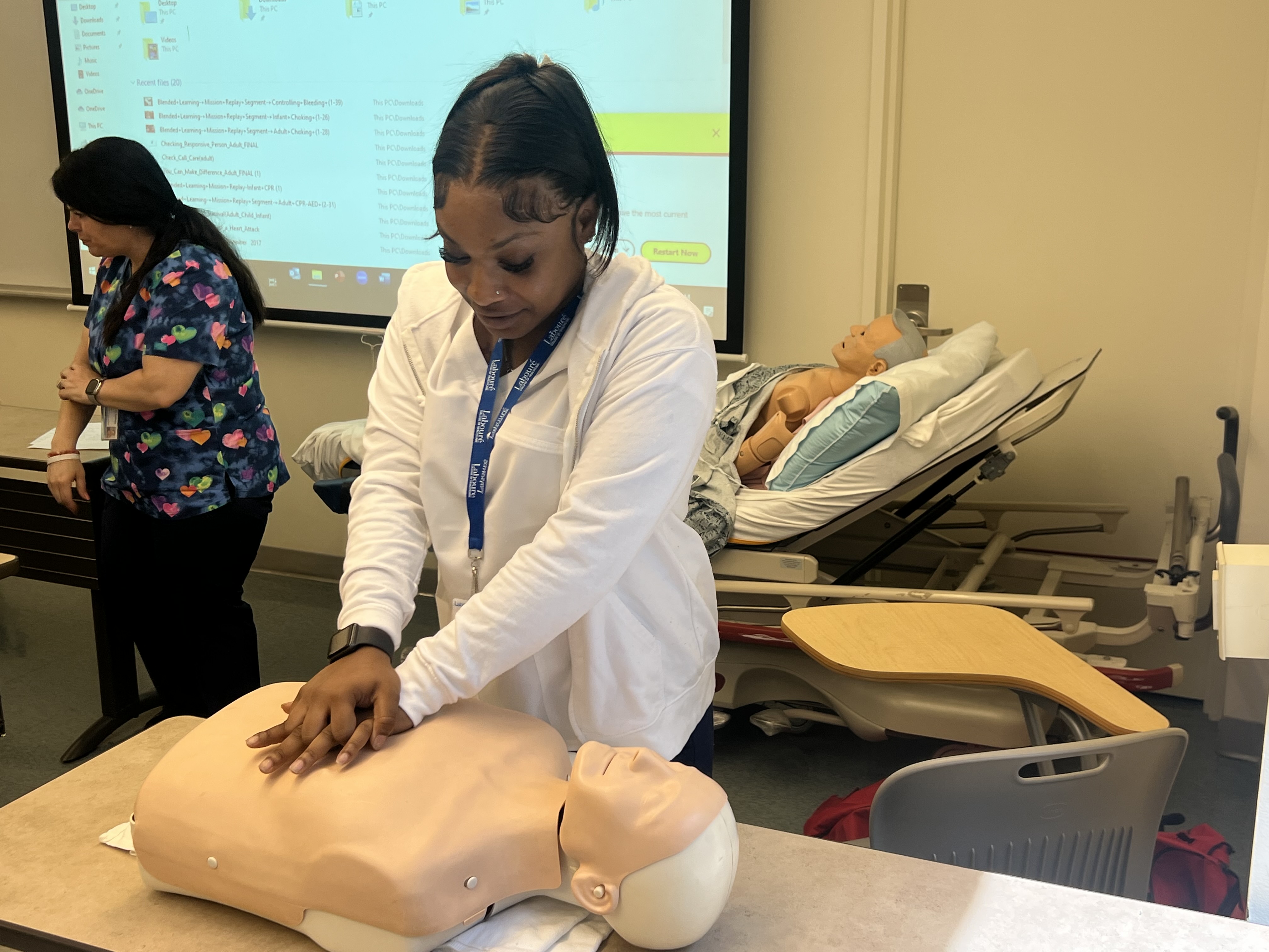 CNA Training Program Participant practicing CPR