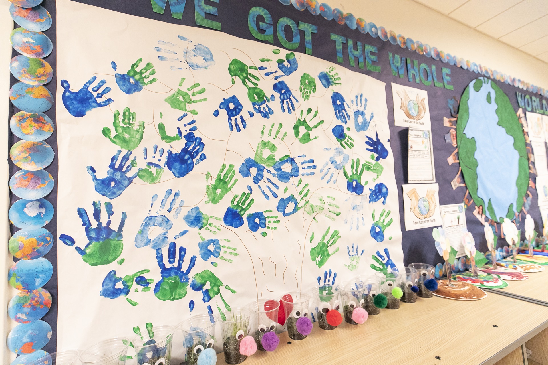 Elementary school classroom decorated with hand prints and crafts