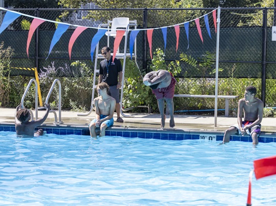 A person dives into Gold Star Pool