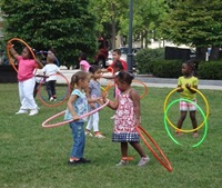 kids playing hula hoop in the park