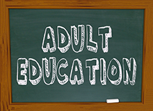 "adult education" written on a blackboard