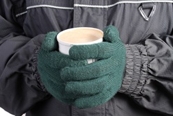 Gloved Hands holding Hot Coffee