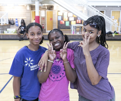 Three pre-teen / middle school girls celebrate at a Cambridge Youth Programs Summer event