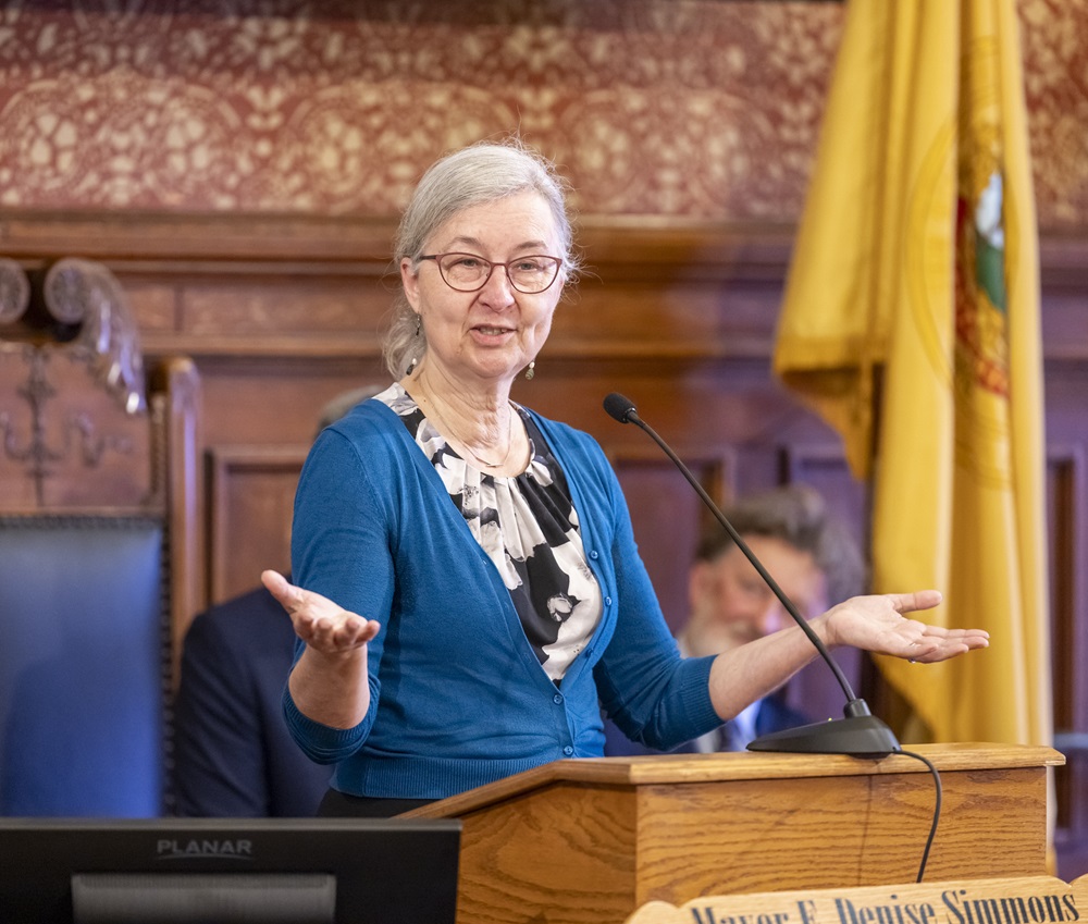 Susanne Rasmussen Speaks at Podium in City Hall