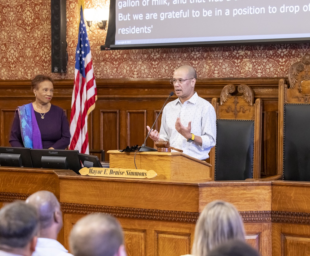 Shamsher Bam Speaks at Podium in City Hall