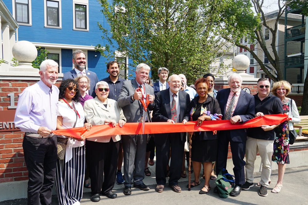 City and state officials, along with community members, celebrate the opening of affordable housing at 116 Norfolk Street