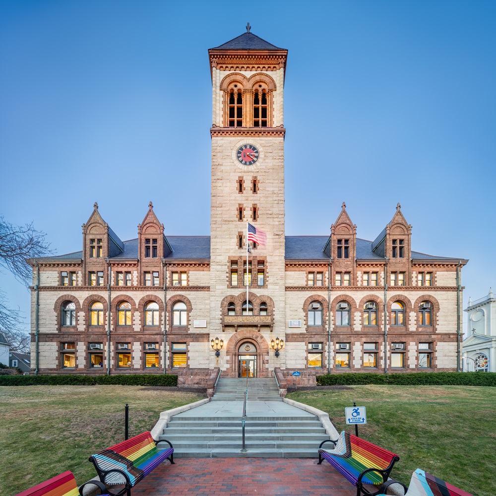Frontal shot of City Hall with a clear blue sky behind it.