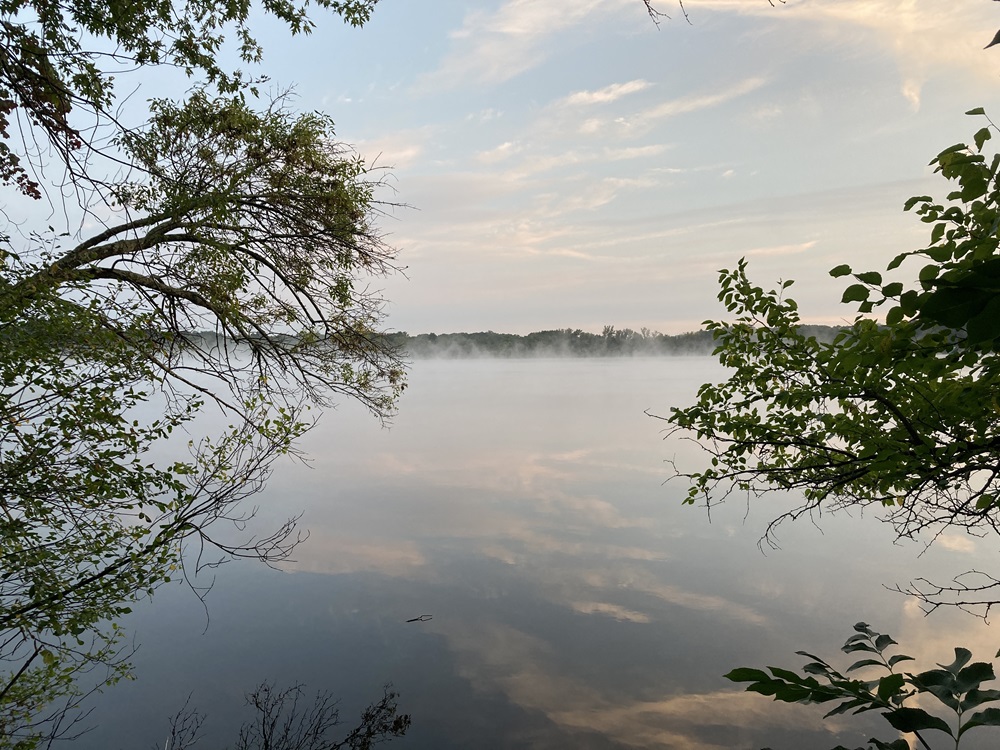 Fresh Pond Reservation peacefully shines during sunset.