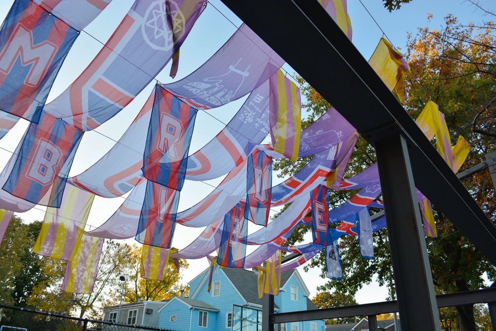 Symbolic flags provide shade and decorate Hoyt Field.