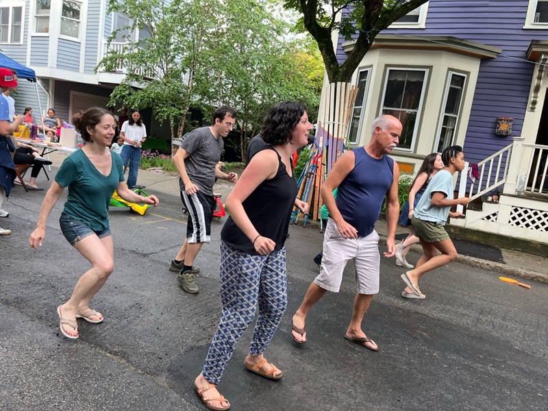 Adults dancing on the street