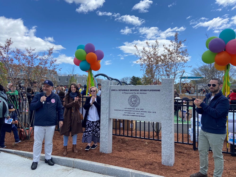 Cambridge City Manager Louis A. DePasquale, with his family: daughter, Kristen, wife, Cheryl, and son, Louis at the unveiling of the new Universal Design playground sign.