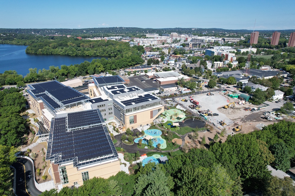 Aerial view of the new Tobin Montessori and Darby Vassall Upper Schools with extensive solar panels.