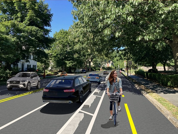 A mock-up of what a two-way separated bike lane with pre-cast concrete curbs could look like on the portion of Brattle Street between Sparks Street and Riedesel Avenue, in front of the Holy Trinity Armenian Church.