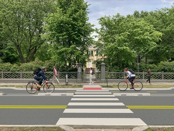A mock-up of what a two-way bike lane with pre-cast concrete curbs could look like in front of the Longfellow House.