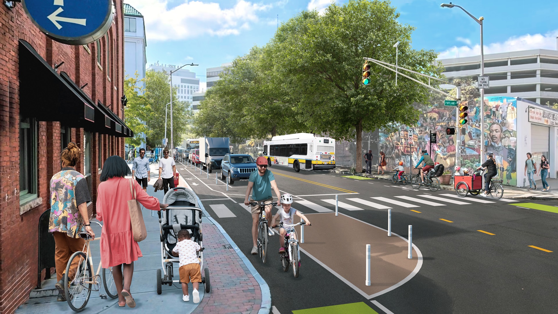 Mock up of what Hampshire Street will look like with separated bike lanes. The image shows the block between Cardinal Medeiros and Broadway.