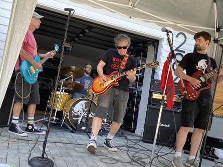 The Stress Balls perform on Broadway during the 2026 Cambridge Porchfest.