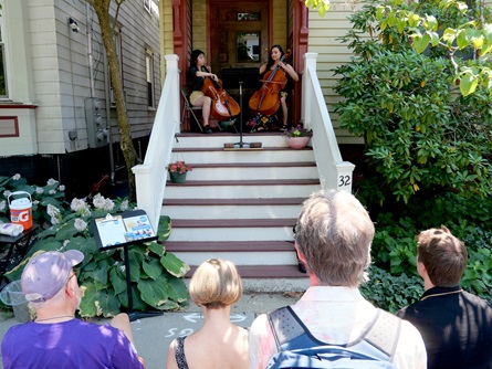 Ana Ospina (right) performs on Esssex Street during the 2026 Cambridge Porchfest.