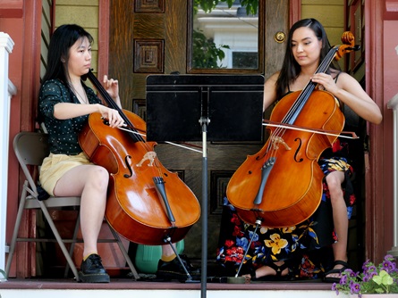 Ana Ospina (right) performs on Esssex Street during the 2026 Cambridge Porchfest.