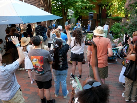 Electric Oaks perform on Auburn Street during the 2026 Cambridge Porchfest.