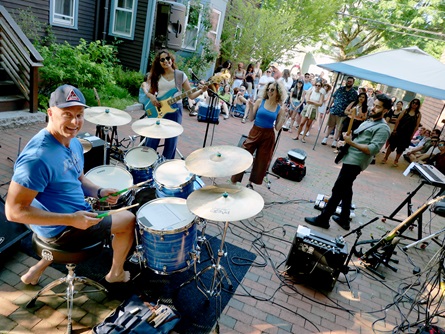 Electric Oaks perform on Auburn Street during the 2026 Cambridge Porchfest.