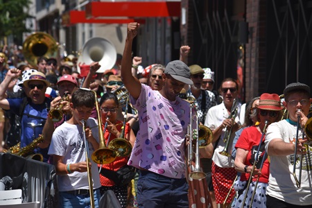 School of Honk performs in Central Square during the 2026 Cambridge Porchfest.