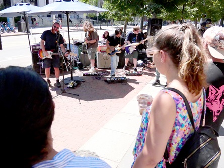 Awnthay perform outside 1369 Coffeehouse on Massachusetts Avenue during the 2026 Cambridge Porchfest.