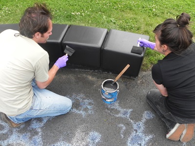 Collections Care Specialist, Rachel Newsam, and contracted Conservation Technician, Vaclav Sipla, repaint the concrete components of the public artwork entitled Turnaround/Surround by artist Mierle Ukeles located at Danehy Park in Cambridge, Massachusetts.