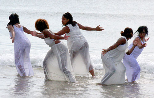 Dancers in ocean surf perform Nailah Randall-Bellinger's “Initiation—In Love Solidarity."