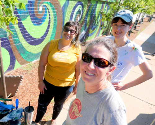 Funded through the City of Cambridge’s Participatory Budgeting Process, three artists—Whitney Van Praagh, Alex Adamo and Kit Collins—created a new, community-inspired mural this fall on the retaining wall at Rindge Field along Pemberton Street between Haskell Street and Yerxa Road.