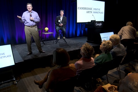Google Industry Director Brian Cusack (left) and Cambridge Arts Executive Director Jason Weeks speak about fostering innovation in technology and the arts at the Community Supported Art Harvest Party at Google Cambridge, Nov. 1, 2017.