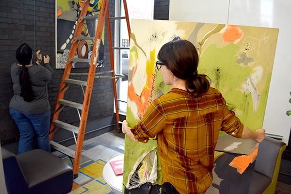 Installing the Creative Marketplace exhibition at Workbar in Central Square, Cambridge, Nov. 5, 2018