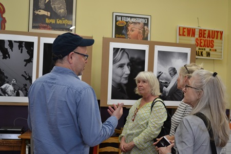 An artist speaks with attendees during Cambridge Open Studios.