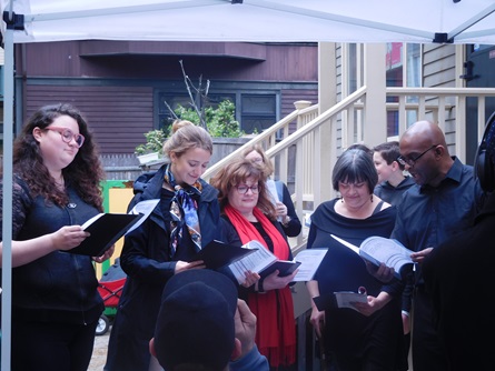 A group of individuals singing in a chorus at Cambridge Arts Open Studios