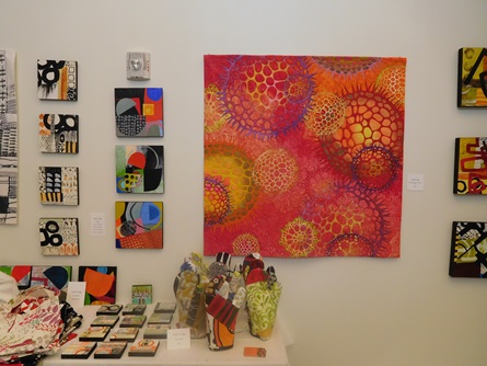 A grouping of colorful paintings by a Cambridge Arts Open Studios artist