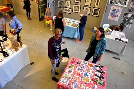 Camille Musser (left) and Diane Charyk Norris at the Lunder Arts Center at Lesley University during the 2018 Cambridge Arts Open Studios.