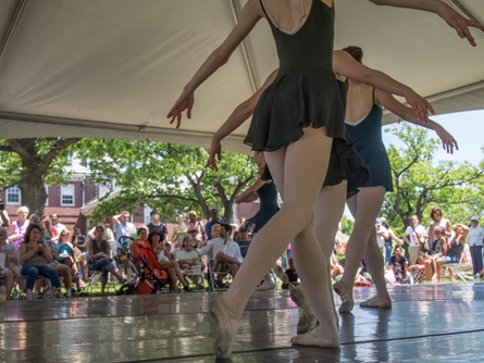 Ballet dancers perform on an outdoor stage during Cambridge River Festival.