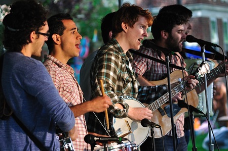 A six-man band performs at Cambridge River Festival.