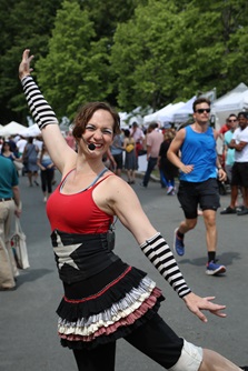 A performer posing at River Festival
